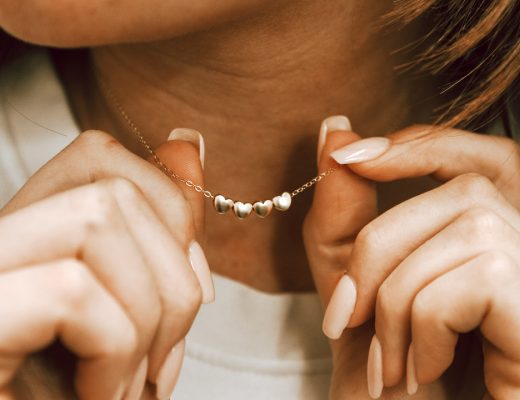 Golden Heart Necklace displayed by a mom as her Valentine's Day Gift